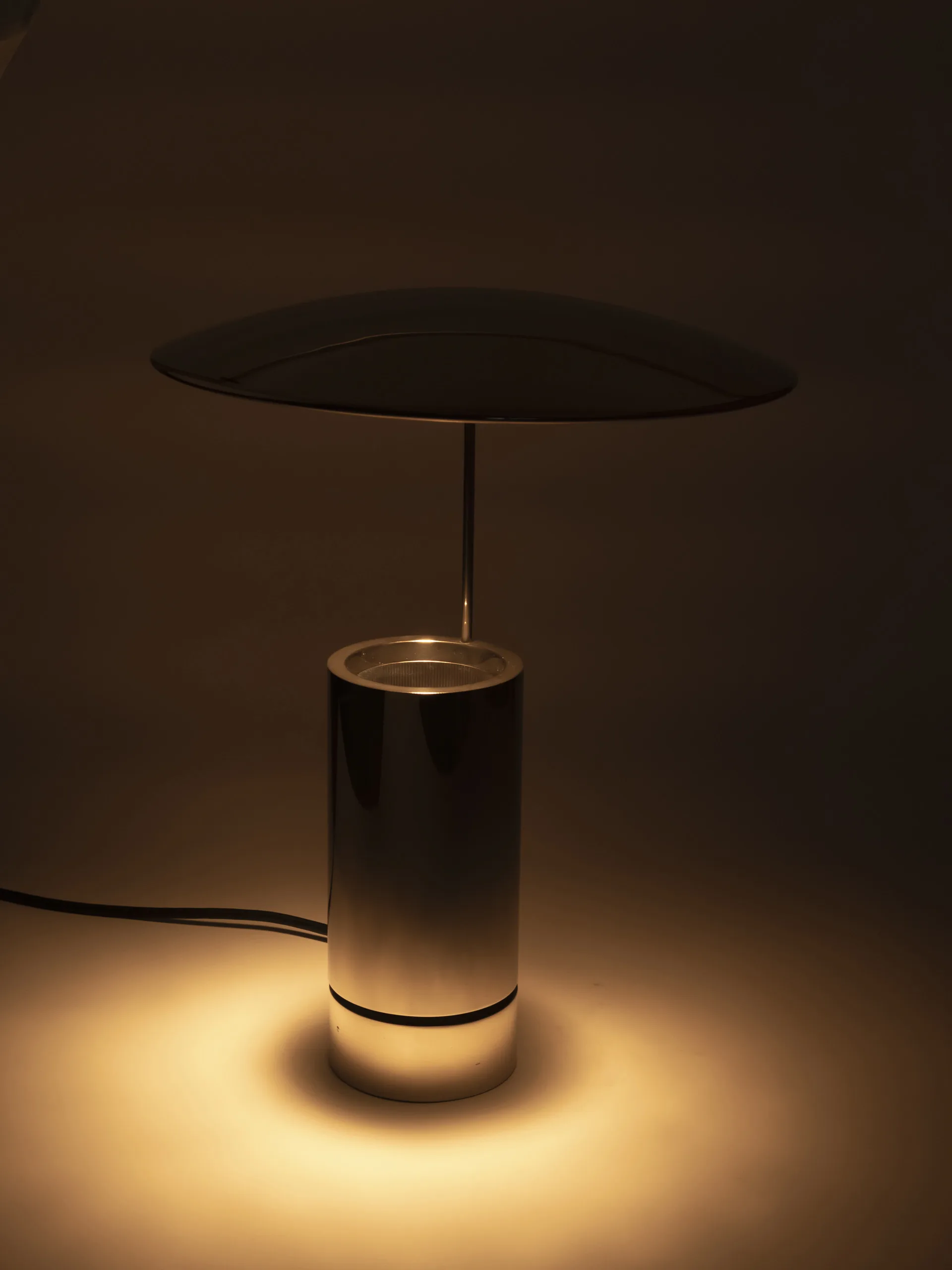 Rare "TOS" nickel-plated metal table lamp by Florian Schulz. Cylindrical fully chrome-plated base with an adjustable chrome reflector plate. Produced between the 1980s and 1990s. Soft - ambiant light